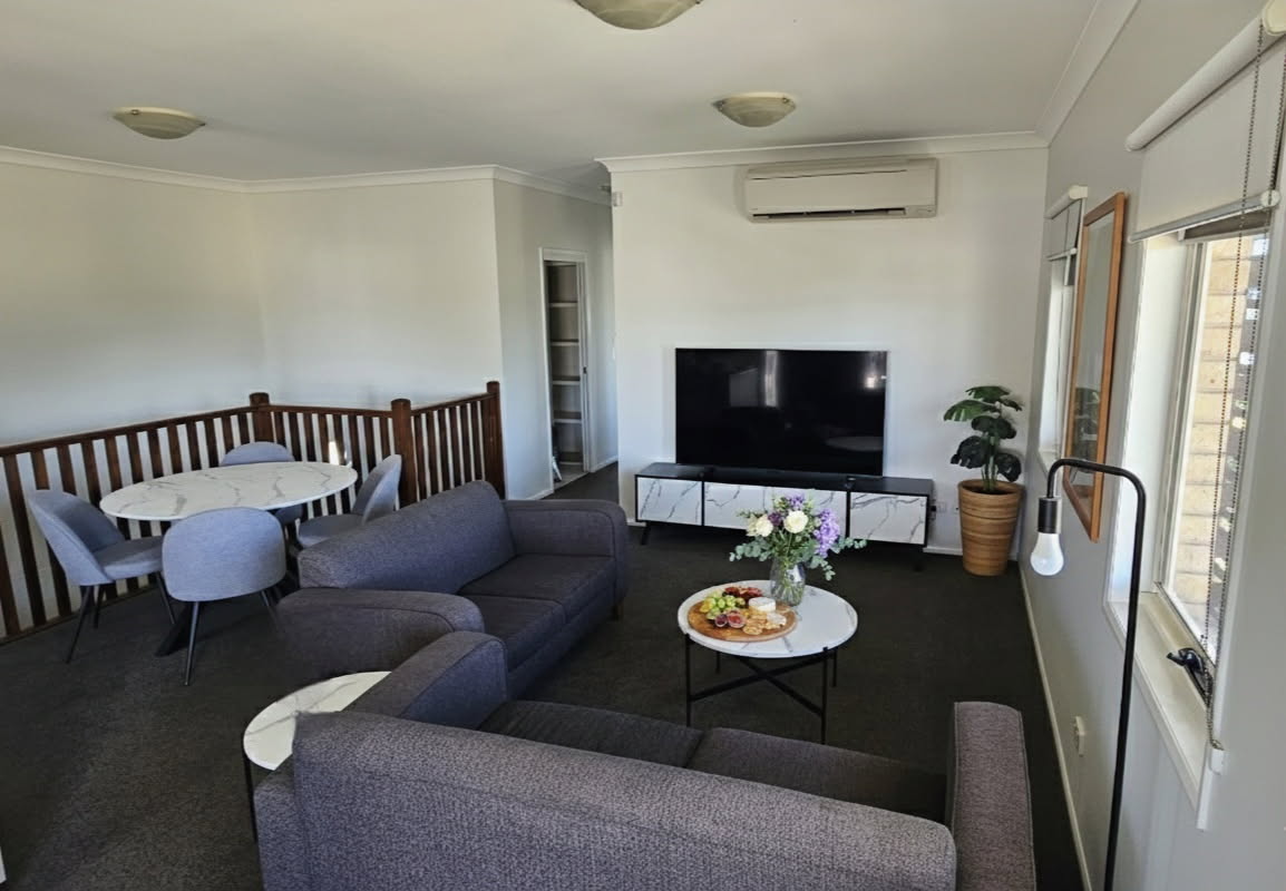 Spacious living room in Two Bedroom Apartment at Emerald Inn